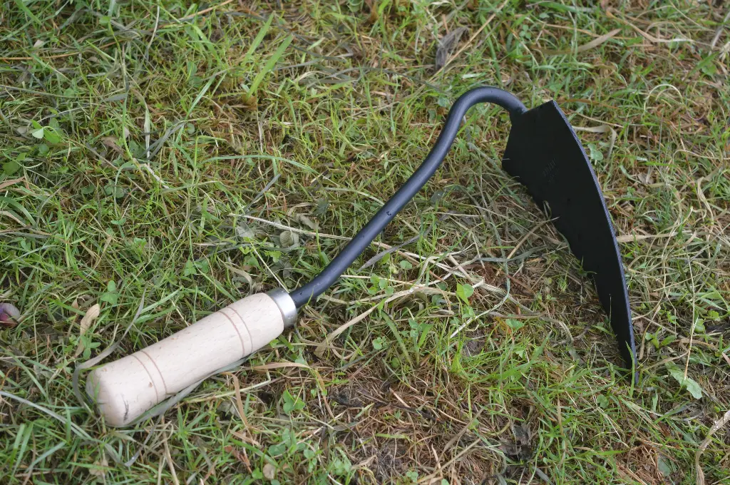 Driehoekige tuinhak met handvat